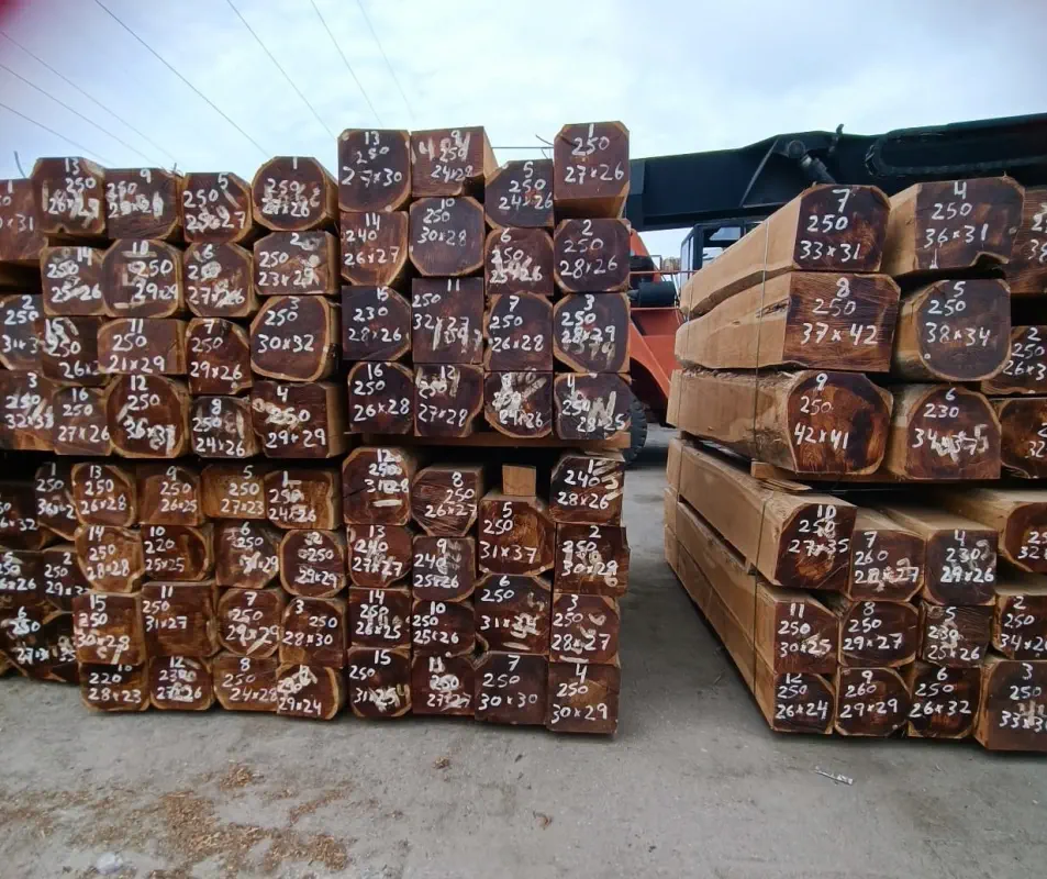 A photograph outside of stacks of rough-sawn-squares