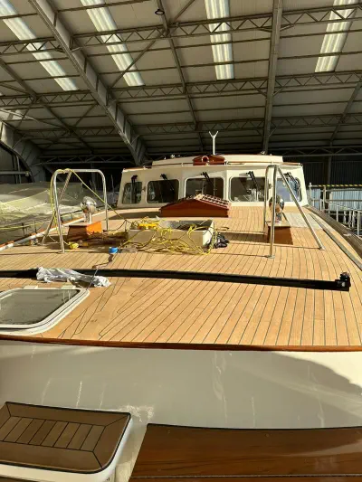 A photograph of a big teak deck on a yacht in a garage made with wood from Easterwoods